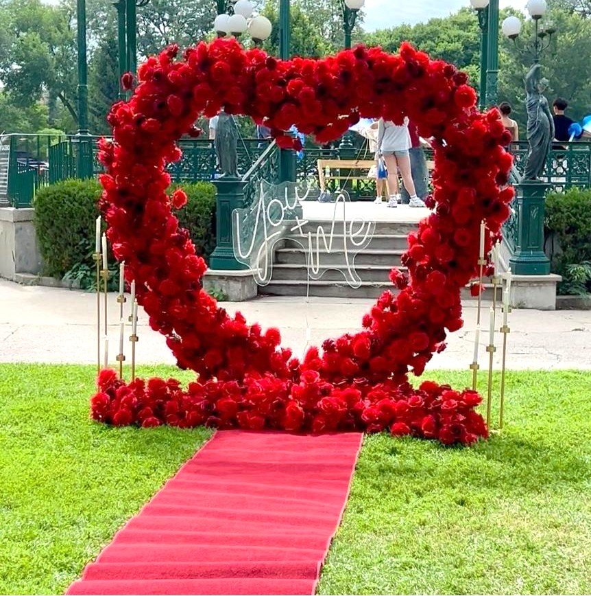 Romantic heart floral proposal setup with red carpet and candelabras in Chicago