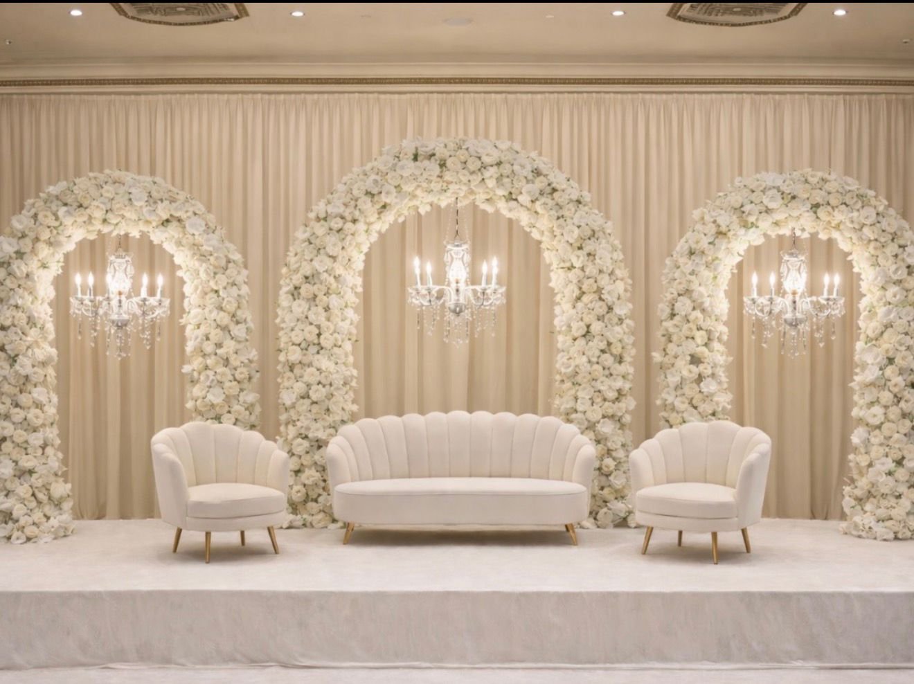 Elegant white floral arch for a luxury wedding ceremony